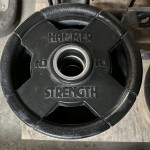 HAMMER STRENGTH ROUND RUBBER OLYMPIC PLATES Used Weights HAMMER STRENGTH ROUND RUBBER OLYMPIC PLATES Used Weights